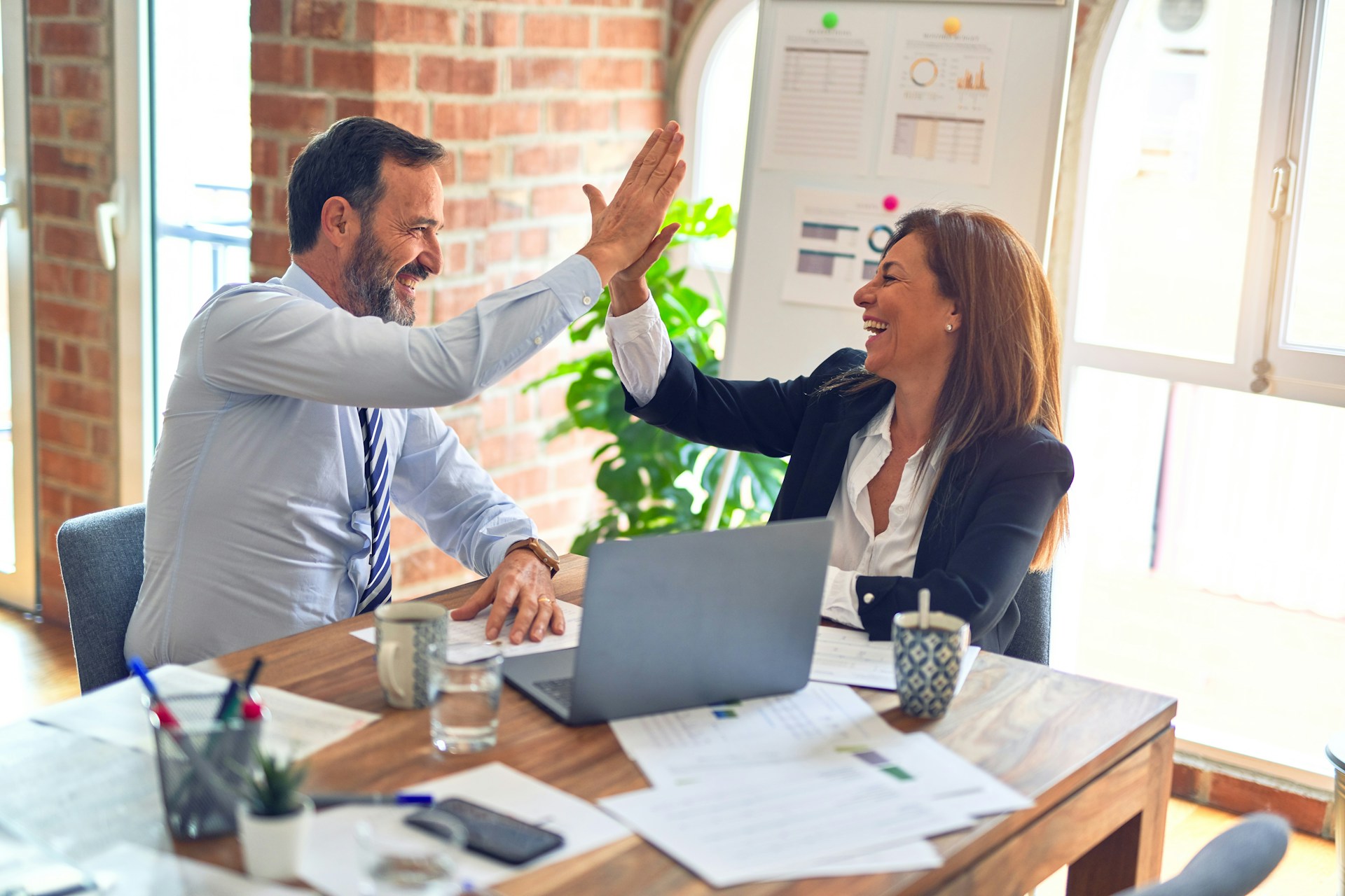 Professionals collaborating over a desk